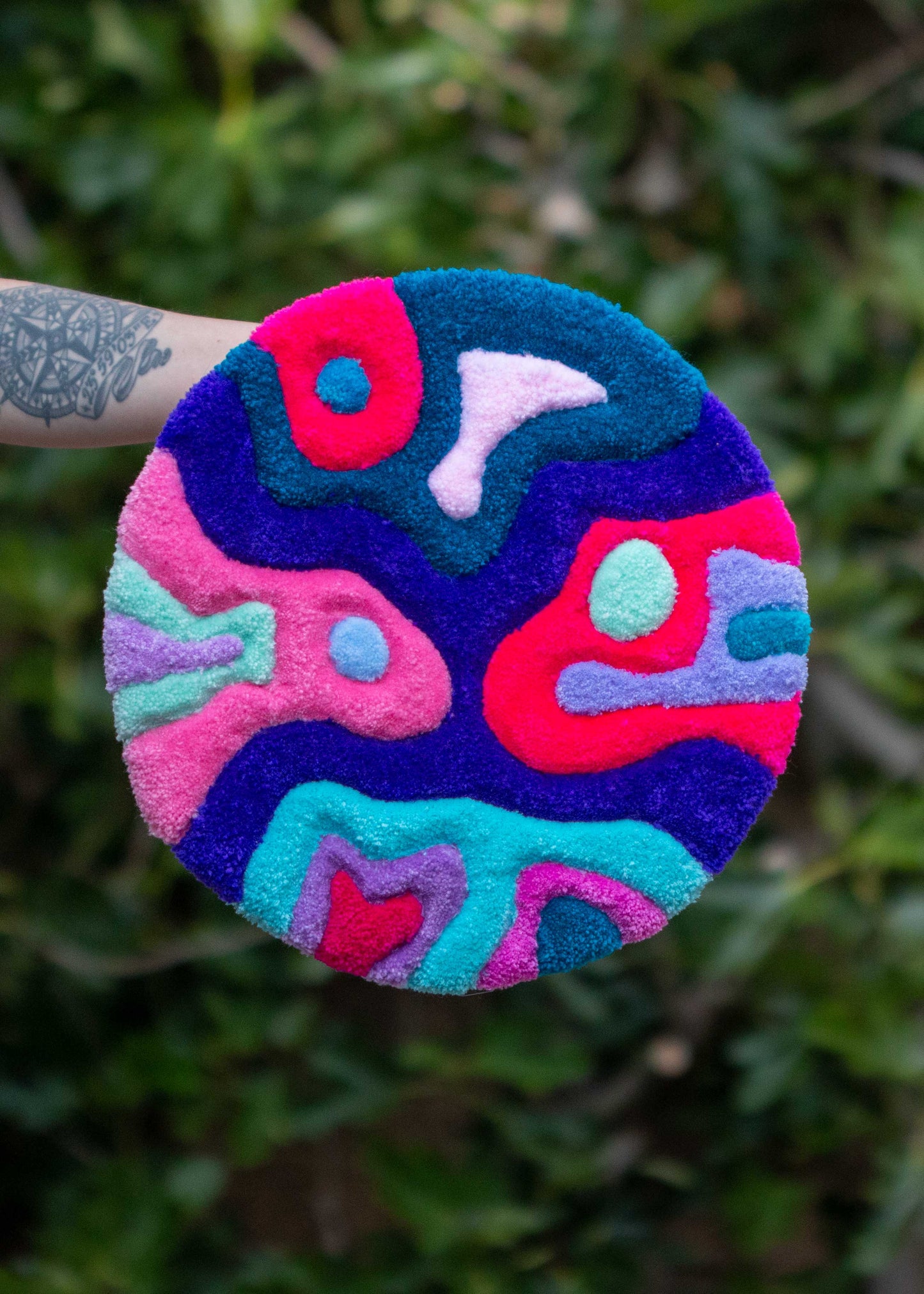 Circular textile wall hanging