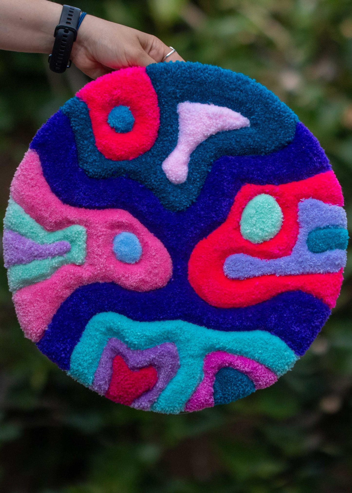 Circular textile wall hanging